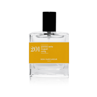 A clear glass perfume bottle with a black cap and a yellow label reading 201 pomme verte muguet coing and Bon Parfumeur Paris, photographed against a white background—a chic find for Tallinn shopping or your favourite gift shop. Gate21.ee