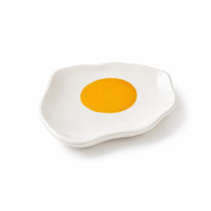 A small, white, irregularly shaped Fried Egg - Jewellery Plate with a yellow circle in the centre, resembling a fried egg. Gate21.ee