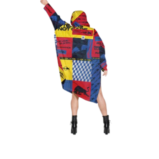 A person wearing the Box Box - Special Edition, a colourful oversized hoodie with red, yellow, blue, and black blocks, stands with one arm raised—an ideal pick for those exploring unique Tallinn shopping or fresh concept shop trends. Gate21.ee