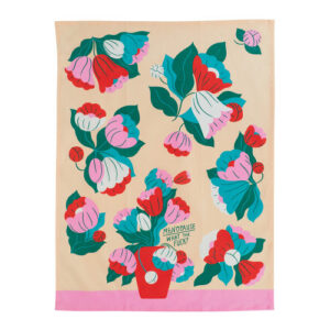 The Menopause - Tea Towel is a beige and pink tea towel decorated with colourful flowers in red, pink, white, and green. Reminiscent of the playful designs found on BlueQ oven gloves, it features a bouquet in a red vase with a speech bubble that reads “Menopause? What the fuck?” in green text. Gate21.ee