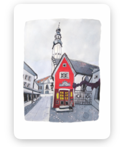 A Wisdom / Old Town Tea-towel - KÕIK features a small red building with yellow windows on a quiet street, set against a tall white church tower and cloudy sky. Gate21.ee