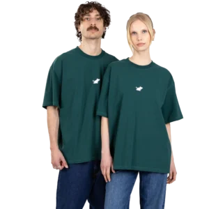 Two people stand side by side against a plain white background, wearing Moomin Heavy Ts in Stone Wash Green with a small white chest graphic, paired with blue jeans. Gate21.ee