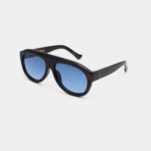 The Rio - Havana (Copy) sunglasses by A. Kjærbede feature thick, dark tortoiseshell frames and blue-tinted lenses, shown angled on a plain white background. Gate21.ee