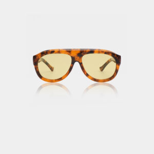 The Rio - Hava sunglasses by A. Kjærbede, featuring a brown and black tortoiseshell frame and yellow-tinted lenses, are displayed on a plain white background. Gate21.ee