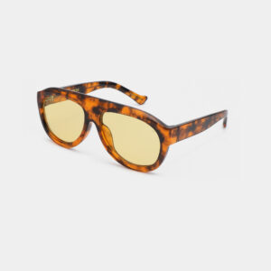 Rio - Hava sunglasses by A. Kjærbede feature yellow-tinted lenses and a thick, brown tortoiseshell-patterned frame, displayed against a plain white background. Gate21.ee