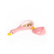 The Milk - Jewellery Box (Copy) is a small, pink ceramic duck with a yellow beak and simple painted eyes. Its removable back section opens to reveal a few gold rings inside, similar in style to the Dreamy cat jewellery plate by Hello Ferretti. Gate21.ee