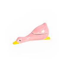A ceramic jewellery box named "Milk - Jewellery Box (Copy)," shaped like a pink goose with a yellow beak and feet, exudes whimsical charm similar to Hello Ferretti’s Dreamy cat plate, shown against a plain white background. Gate21.ee