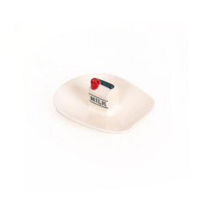 The Incense burner - Milk is a small, square ceramic dish with rounded edges, featuring a mini milk carton with a red cap and “MILK” in blue—a playful, modern piece inspired by Helio Ferreti’s colourful designs. Gate21.ee