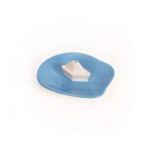 The Incense burner - House (Copy) is a small ceramic dish featuring an irregular blue base and a white geometric cone centre, inspired by Helio Ferreti’s modern, colourful designs, shown on a plain white background. Gate21.ee