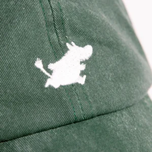 A close-up of the Moomin Cap - Green shows a white embroidered cartoon hippopotamus outline, reminiscent of Moomin keyrings, displayed on the front. Gate21.ee