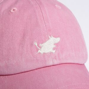 A close-up of the Moomin Cap, a pink baseball cap with a small white embroidered cartoon animal on the front—ideal for pairing with your favourite cute Moomin keyrings. Gate21.ee