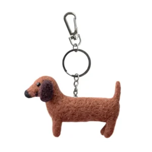 The Cherry - Felt key ring (Copy) features a small brown felt dachshund dog with black eyes, a black nose, and includes a silver keyring with a clasp. Gate21.ee
