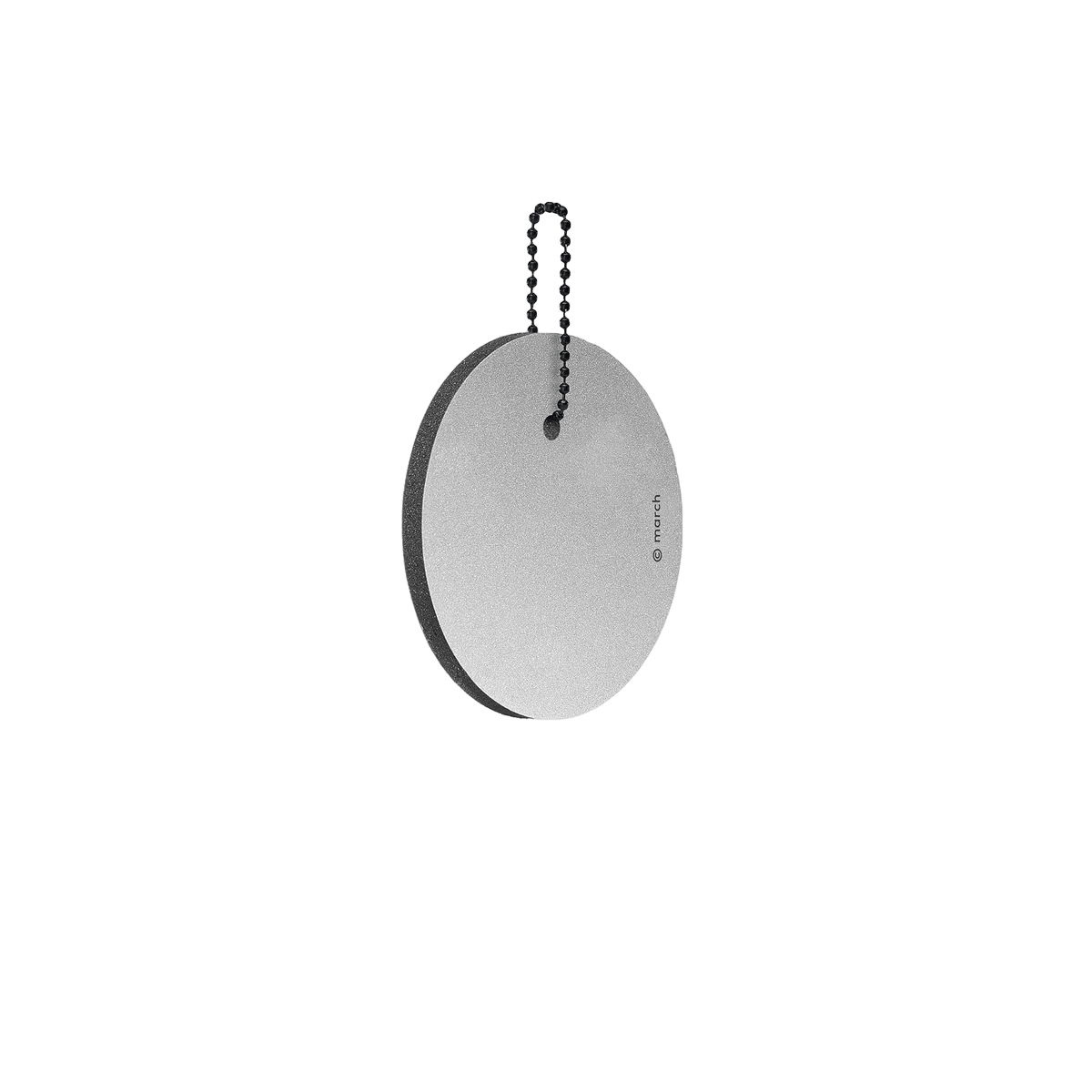 The Dangle - Round - Grey features a flat, round grey reflector with a thin black edge, hanging from a beaded metal chain against a white background with a faint shadow underneath. Gate21.ee