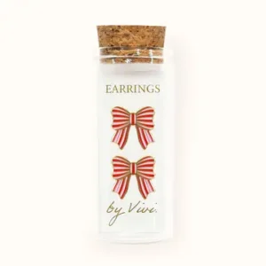 A clear glass phial with a cork stopper holds a card displaying Tennis earrings by Vivi (Copy). Gate21.ee