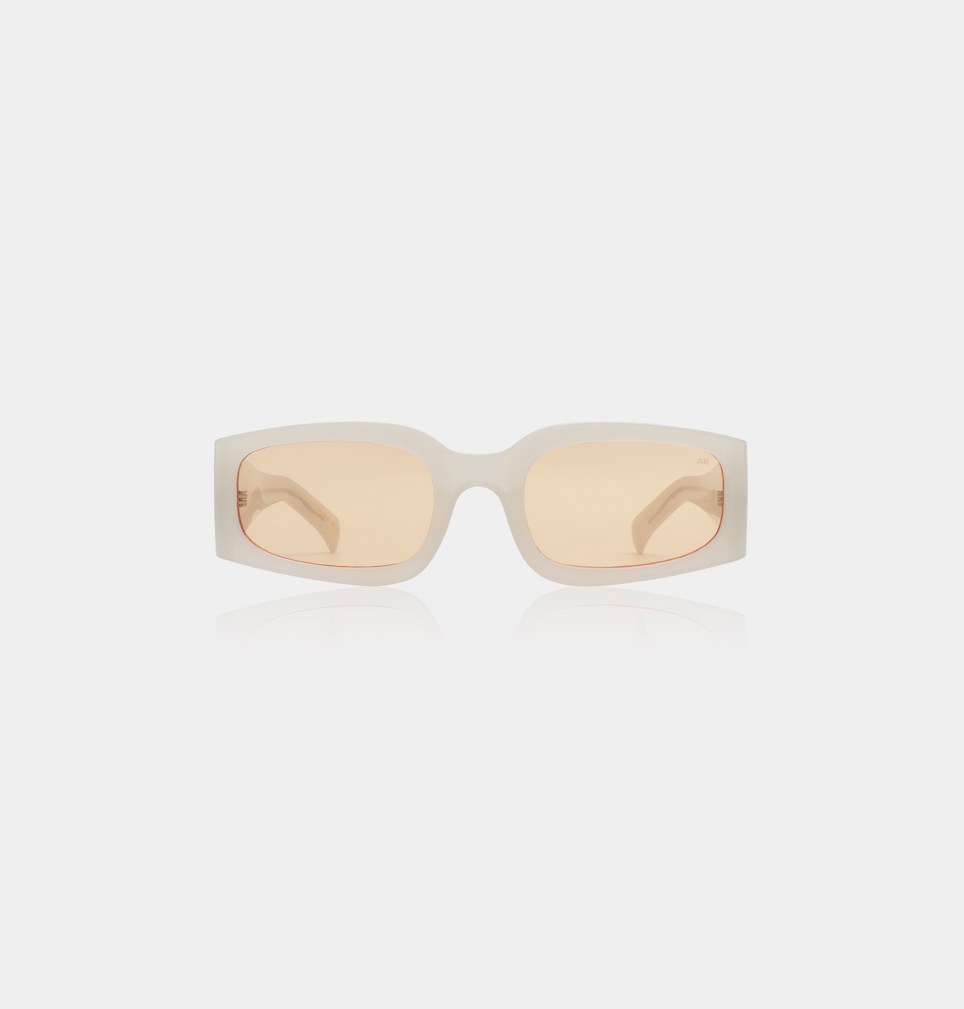 A pair of ALEX - Grey Transparent sunglasses from A. Kjærbede, featuring rectangular frames, is centred on a plain white background. Gate21.ee