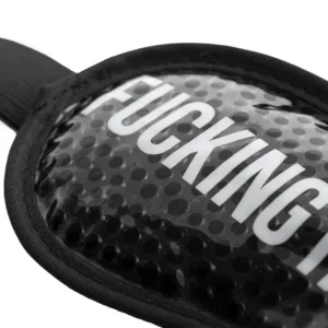 Close-up of the "Fucking Hangover" gel eye mask in black, featuring a textured, spotted surface and large white “FUCKING HA” text. The mask includes a fabric edge and strap—ideal for bright nights. Gate21.ee