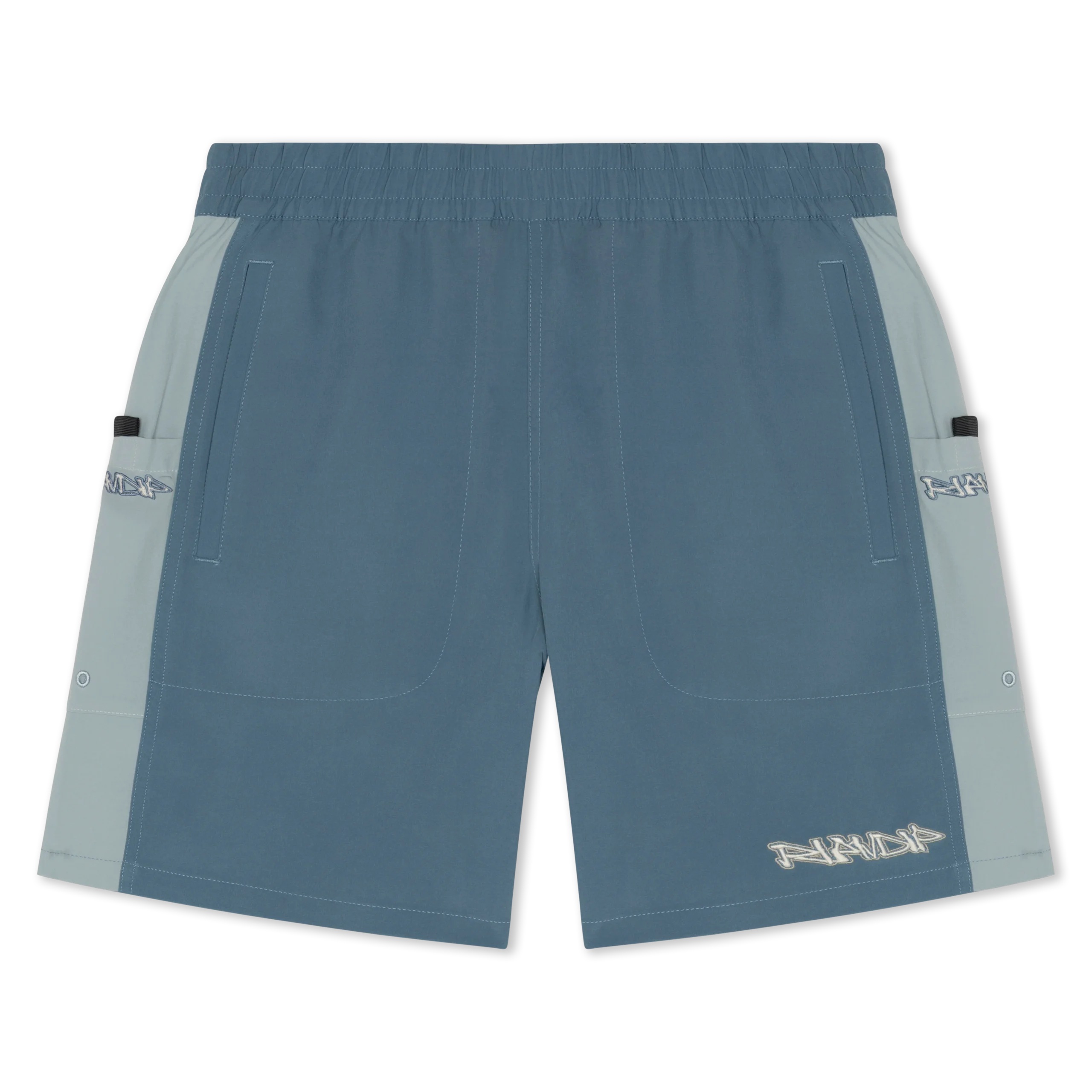 The Nermal Swim Shorts - Slate are teal blue Ripndip swim shorts with light blue side panels, an elasticated waistband, roomy front pockets, side pocket flaps, and a white logo graphic on the left leg. Gate21.ee