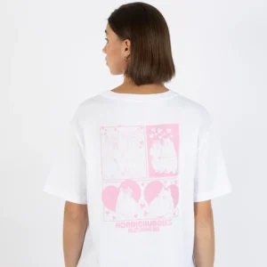 A person with straight brown hair faces away, wearing the Moomin Heavy Ts - Sniff - White, a T-shirt with pink cartoon Moomin illustrations and hearts on the back. The shirt reads NORDIC BUDDIES CLOTHING CO. at the bottom of the design. Gate21.ee