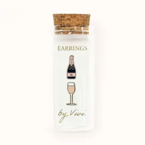 A clear glass bottle with a cork lid contains two enamel Tennis earrings, displayed on a card labelled "Tennis earrings by Vivi. Gate21.ee