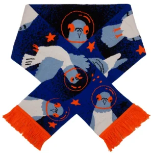The Fox - Organic (Copy) scarf is blue and white with an orange fringe, featuring birds in orange space helmets, orange stars, and blue shades. It is displayed in a criss-cross shape. Gate21.ee