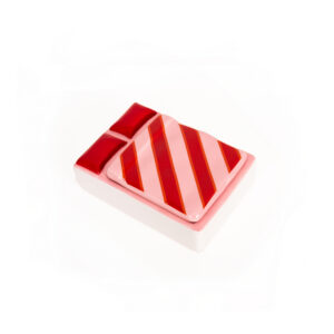 A whimsical rectangular ceramic jewellery box inspired by the Duck - Jewellery Box (Copy) from Hello Ferretti, featuring a pink and red striped blanket design with two red cushions, photographed on a white background. Gate21.ee