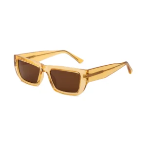 Rectangular FAME - Black sunglasses by A. Kjærbede, featuring a transparent amber frame and brown lenses, shown on a white background. Gate21.ee
