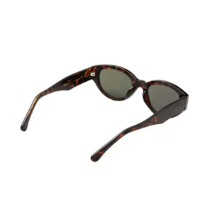 A pair of Winnie - Demi Tortoise A. Kjærbede sunglasses featuring a tortoiseshell pattern and round, dark lenses. The sunglasses are positioned to display both the front and temples against a plain white background. Gate21.ee