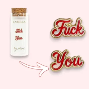 A pair of F*ck You earrings by Vivi, designed in bold red script with gold trim, create an eye-catching statement accessory. Shown alongside a small corked bottle labelled Earrings by Vivi, a playful arrow directs attention from the bottle to these vibrant earrings. Gate21.ee