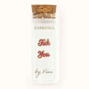 A small glass jar with a cork lid holds the F*ck You earrings by Vivi, featuring two earrings with bold red script. The jar is labelled “EARRINGS” and “by Vivi.” in gold lettering, adding a cheeky touch to this unique accessory set. Gate21.ee