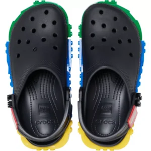 A pair of Crocs™ 4LW System Clog shoes in white, featuring colourful LEGO-like brick accents on the sides and back, viewed from above. The Crocs and LEGO logos are visible on the insoles. Gate21.ee
