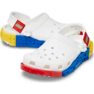 The Crocs™ 4LW System Clog in White showcases LEGO-inspired accents, with bold red, blue, and yellow detailing on the soles and straps that mimic the look of LEGO bricks. Gate21.ee