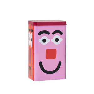 Kitchen Storage / Coffee Tin - Faces: This rectangular metal tin, featuring a vibrant red lid and playful cartoon-style faces on the front and side, is perfect for wrapping coffee tins. The main design showcases a cheerful pink face with large expressive eyes, a red nose, and a friendly curved smile. Gate21.ee