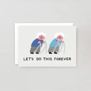 Wrap greeting cards featuring two elderly people with walking frames in blue and teal jumpers, side by side, with “LET'S DO THIS FOREVER” below. Includes an envelope. Product: Forever! - Greeting Card. Gate21.ee