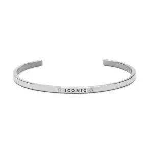 Showcasing timeless style, the Iconic bracelet features a sleek silver cuff with the word “ICONIC” engraved on the front, flanked by two small round gemstones. Photographed against a plain white background, this striking bracelet exemplifies elegant design. Gate21.ee