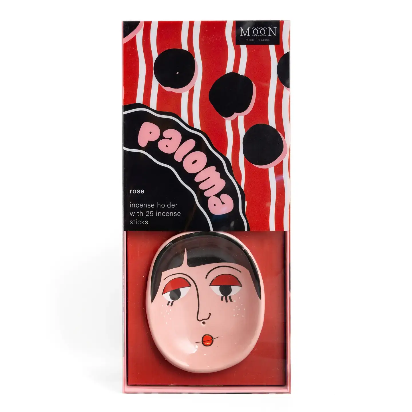 The Paloma Faces - Incense Burner by Wick & Vessel is a boxed home fragrance set featuring a painted face design and the word “paloma” on the packaging. It includes 25 rose-scented incense sticks, and the box showcases bold red, white, and black patterns. Gate21.ee
