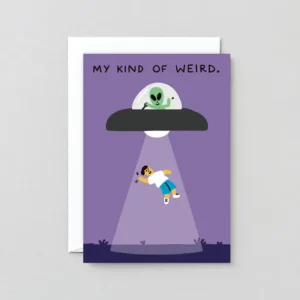 A cartoon alien in a UFO beams up a smiling person on a purple background. The My kinda Weird! - Greeting Card comes with a white envelope partially visible behind the card. Gate21.ee