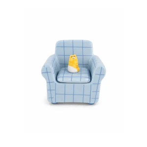 A small Dog Multi-coloured Sofa - Jewellery Box (Copy) shaped like a light blue armchair with a blue grid pattern and a yellow-and-white cat figurine sitting on the seat. Gate21.ee