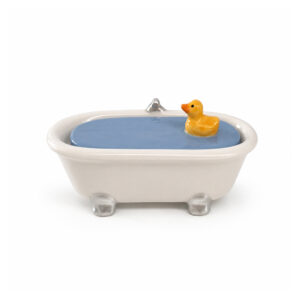A Dog Multi-coloured Sofa - Jewellery Box shaped like a ceramic bath containing a small yellow rubber duck toy. Gate21.ee
